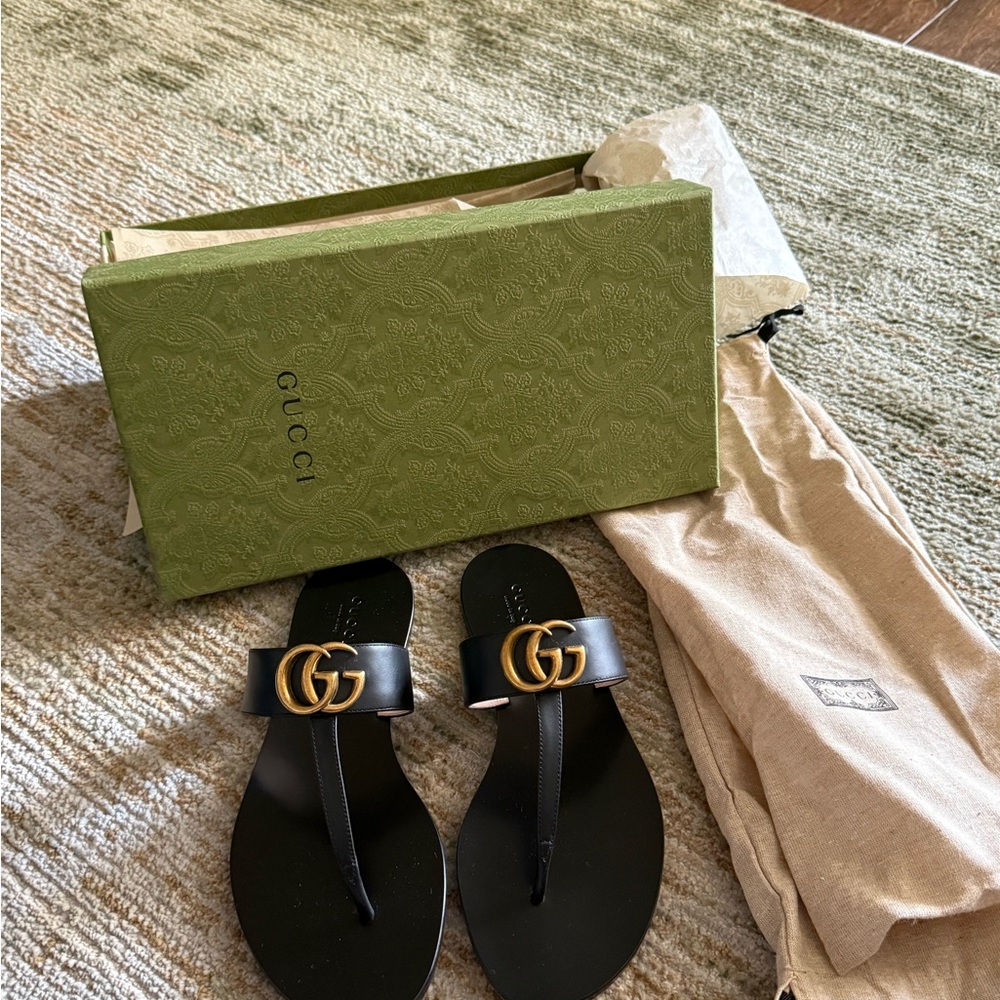 Gucci Black Flip Flops with Gold Emblem